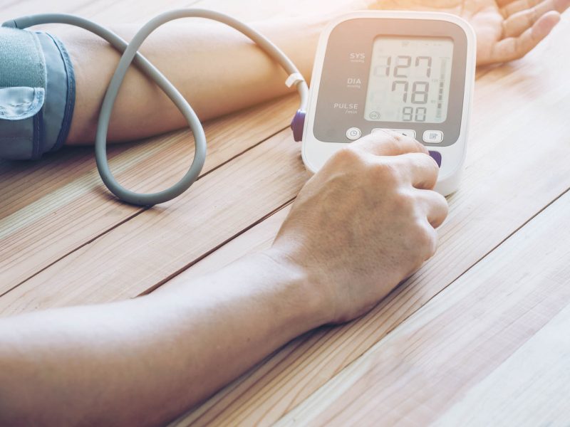 Man is taking care for health with hearth beat monitor and blood pressure